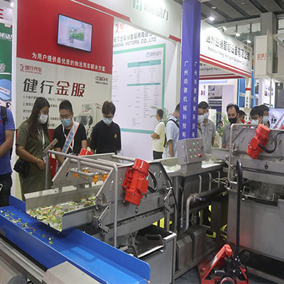 Close-up of a high-precision meat cutting machine being demonstrated at the exhibition.