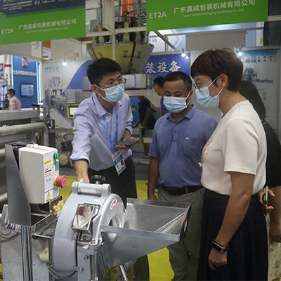 Booth featuring a range of meat processing machines designed for industrial use, including cutters and grinders.